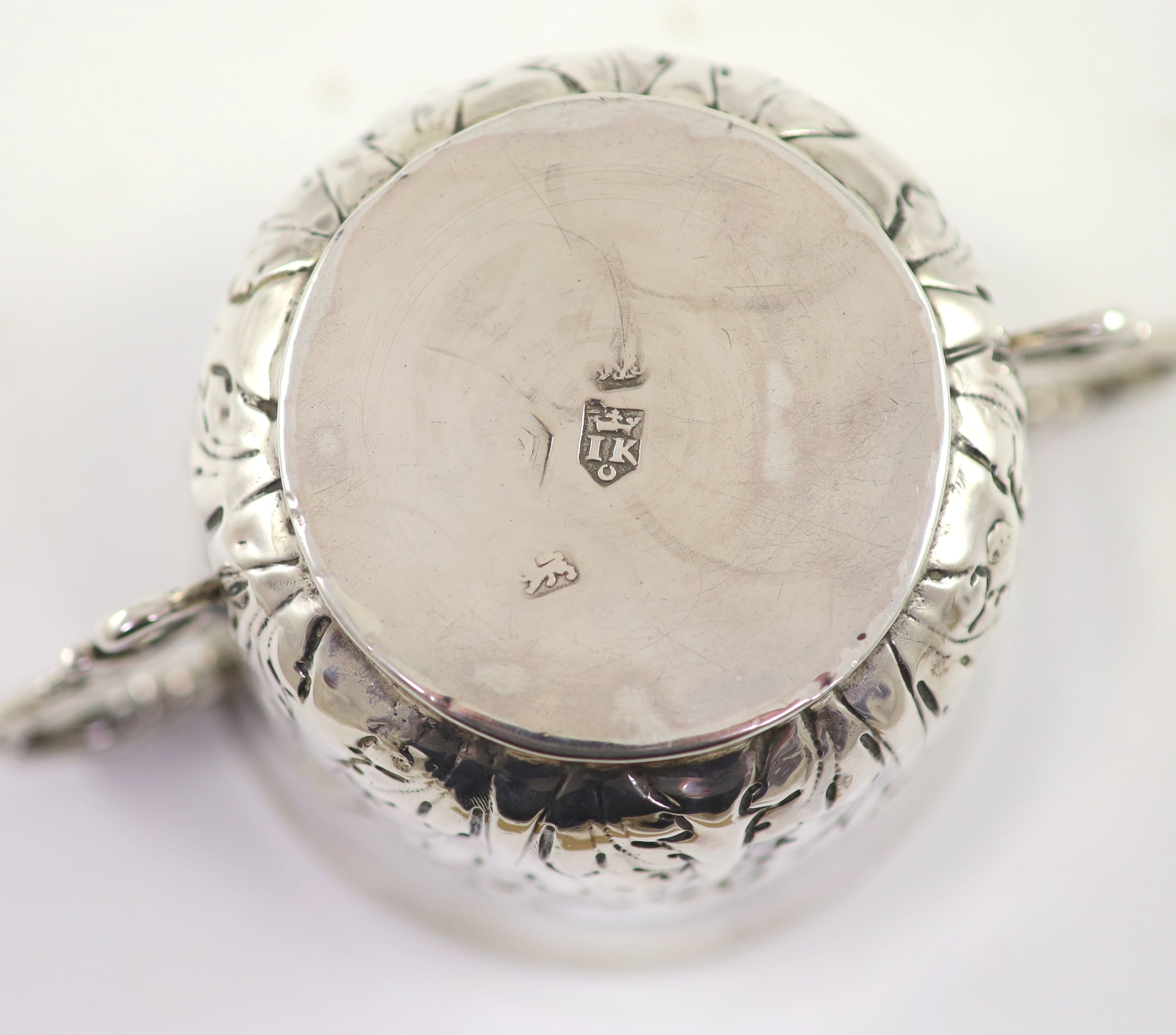 A William III repousse silver porringer, by Jonah Kirk, London c.1695